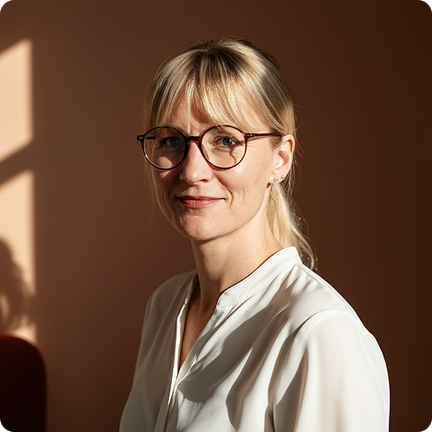 Women with glasses smiling at the camera